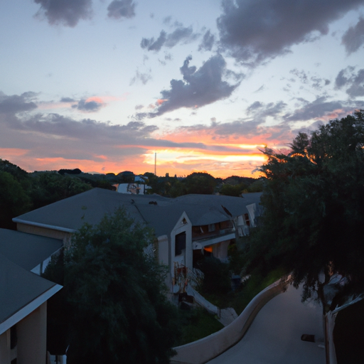 A photo of a sunset over an Austin neighborhood